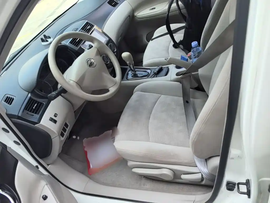 Nissan Tiida 2014 — фото 15